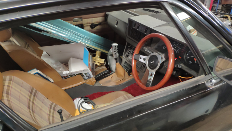 A nice wooden Mountey wheel with plenty of junk to go with it...